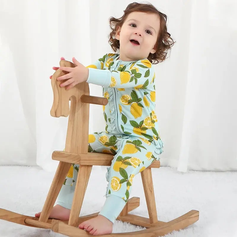 Fabricante de mamelucos para bebés con cremallera y estampado de frutas personalizado
